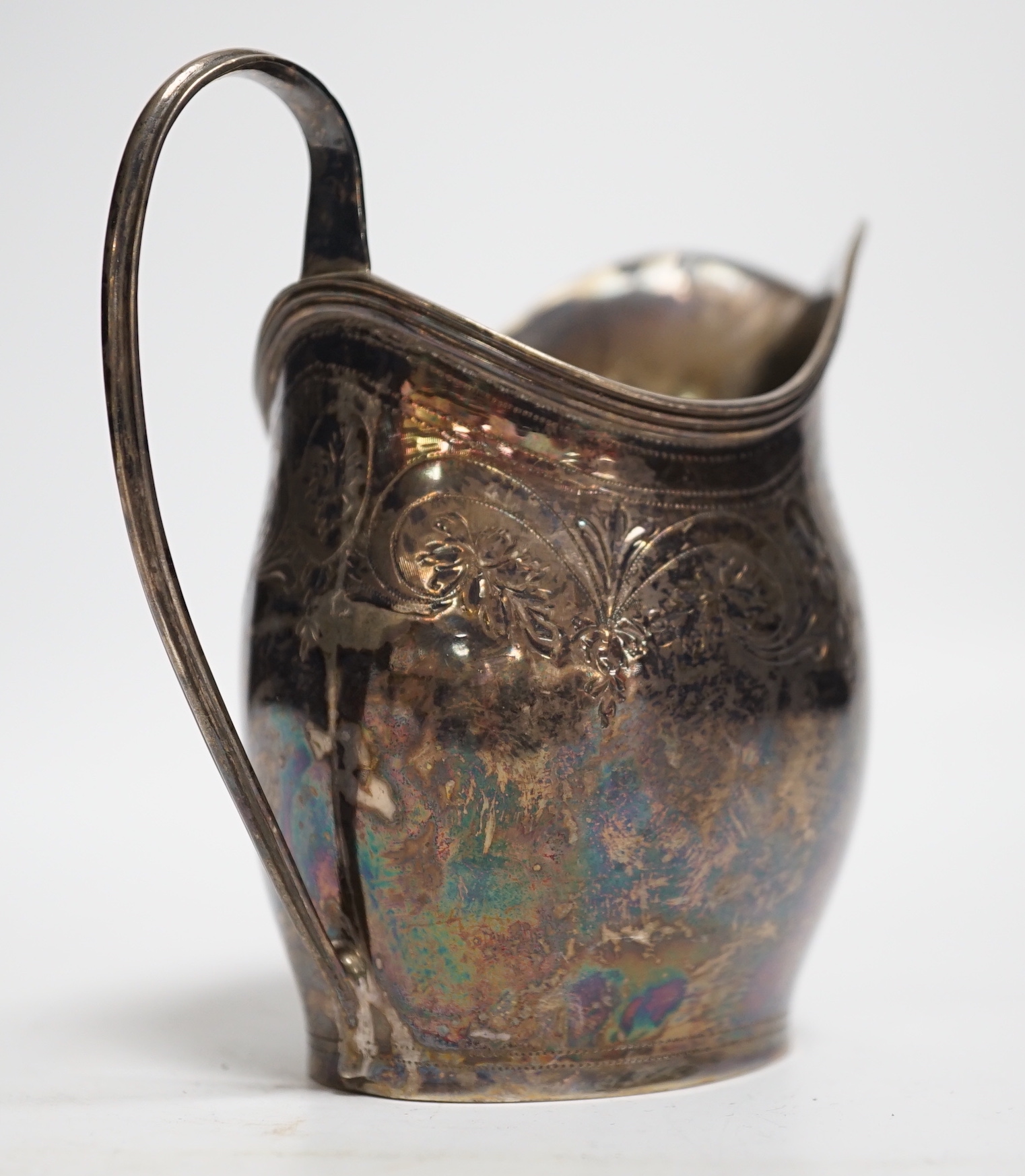 A George III engraved silver helmet shaped cream jug, London, 1799, 10.4cm, 3.2oz.